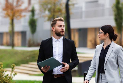 two young business professionals outside