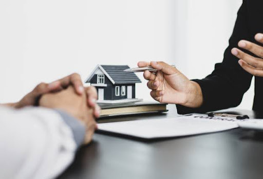 real estate deal with house on table