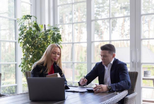 two real estate agents working at desk